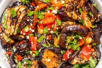 grilled eggplant and paprika with herbs, garlic and olive oil