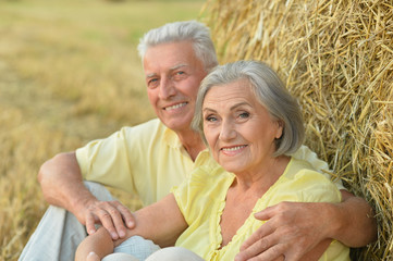 Senior couple at  summer field