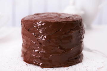Tasty chocolate cake on light background