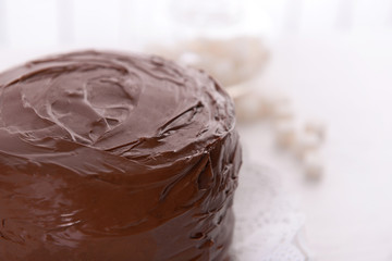 Tasty chocolate cake on light background
