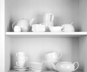 Dishes in cupboard in the kitchen