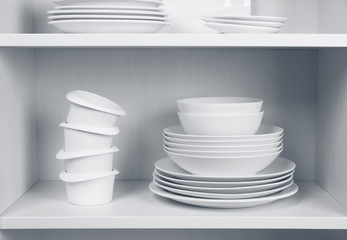 Dishes in cupboard in the kitchen