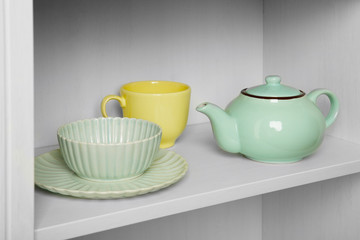Dishes in cupboard in the kitchen
