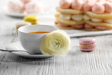 Cup of tea with delicious cakes