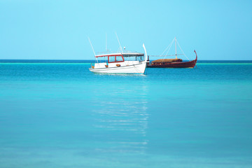 Fototapeta premium Boats in blue ocean.