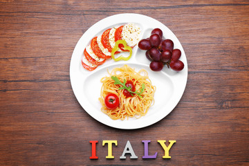 Traditional Italian lunch on wooden background