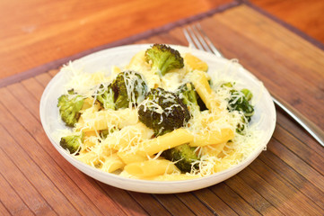 Baked broccoli and pasta with melted cheese