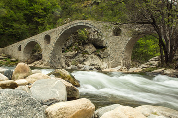 Fototapeta na wymiar The Devil's Bridge. An old Roman Bridge in Rodhope Mountains, Bulgaria.