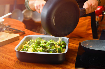 Baked broccoli and pasta with melted cheese