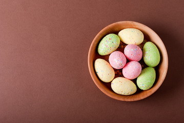 Easter eggs in a bowl, top view