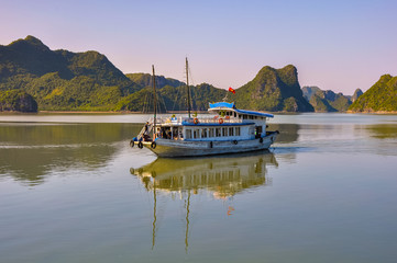 Commuter ship among the islands in Halong Bay