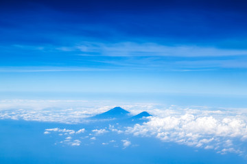 Blue volcano view from airplane flight Surabaya to Jakarta.