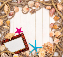 background with star fish and marine rope on a white wooden back