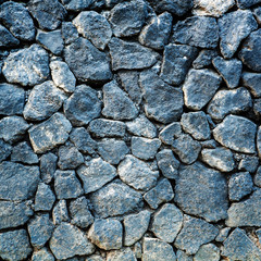 volcanic pumice rock wall background.