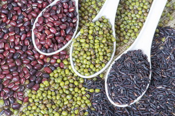 selective focus on spoon of black rice