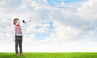 Kid boy with megaphone