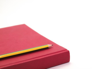 Red Book and Pencil