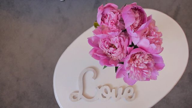 the peons on the table. wedding bouquet of the bride. decorations for Banquet