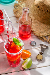 Cold summer drink with citrus fruit