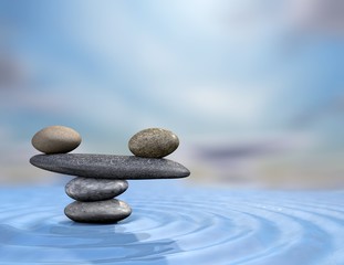 Zen rocks on water blue background.