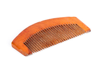 An old wooden comb on isolated white background.