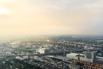 Naklejka na ściany i meble Aerial view of Bangkok city, foggy and dim sunset light