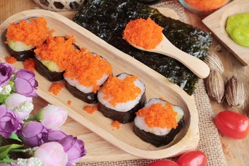 Sushi roll with shrimp eggs is delicious.