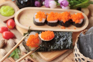 Sushi roll with shrimp eggs is delicious.