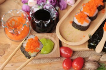 Sushi roll with shrimp eggs is delicious.