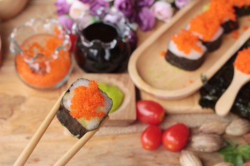 Sushi roll with shrimp eggs is delicious.