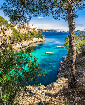 Mediterranean bay with rowboats at Cala Fornells Majorca Spain
