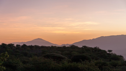 Morning glow against mountains background. Manyara Lake National Park, Tanzania.
