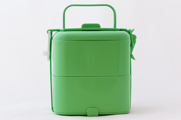 Green food carrier on white background.