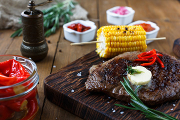 Delicious beef steak on wooden table