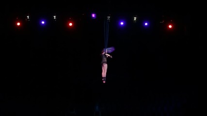 the girl performs a trick in circus
