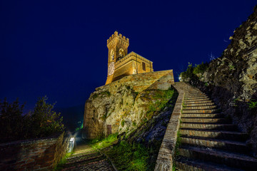 night view of crenellated clock tower