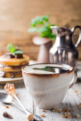 Cup coffee for breakfast with pancakes. 