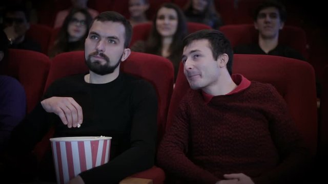 Man disturbs another person by talking in cinema