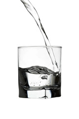 Water pouring into transparent glass isolated on white