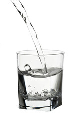 Water pouring into glass isolated on white