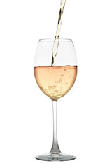 White wine flowing into a glass isolated on white