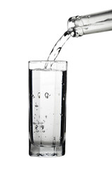 Water pouring out of bottle isolated on white