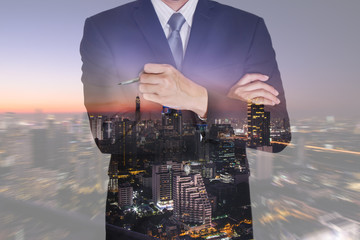 Double exposure of business man think idea and night cityscape on camera zoom background  as vision of leader concept.