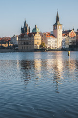 Fototapeta na wymiar Old Town reflected in the River Vltava shot from Strelecky Ostrov Island Prague at sunrise