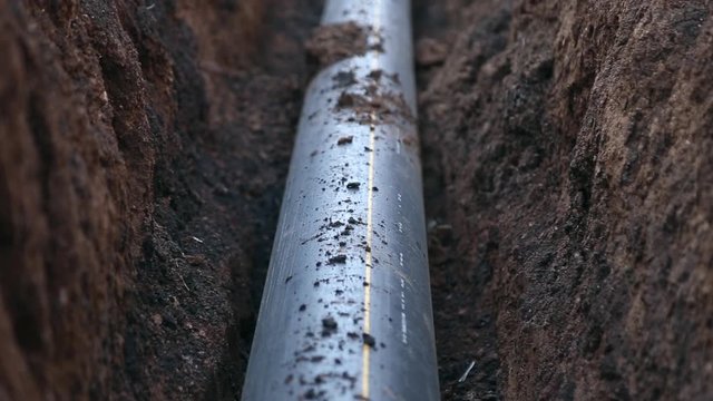 A trench with a gas  pipeline, polypropylene pipe
