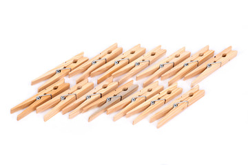 Natural wood clothespins separated on white background
