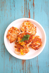 cutlets from poultry with grains of corn