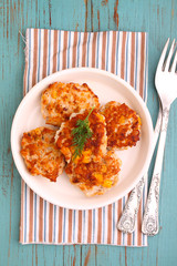 cutlets from poultry with grains of corn