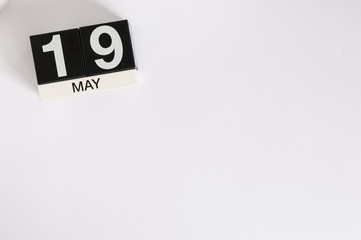 May 19th. Image of may 19 wooden color calendar on white background.  Spring day, empty space for text