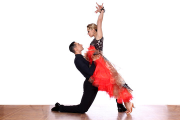 Latino dancers in ballroom against white background